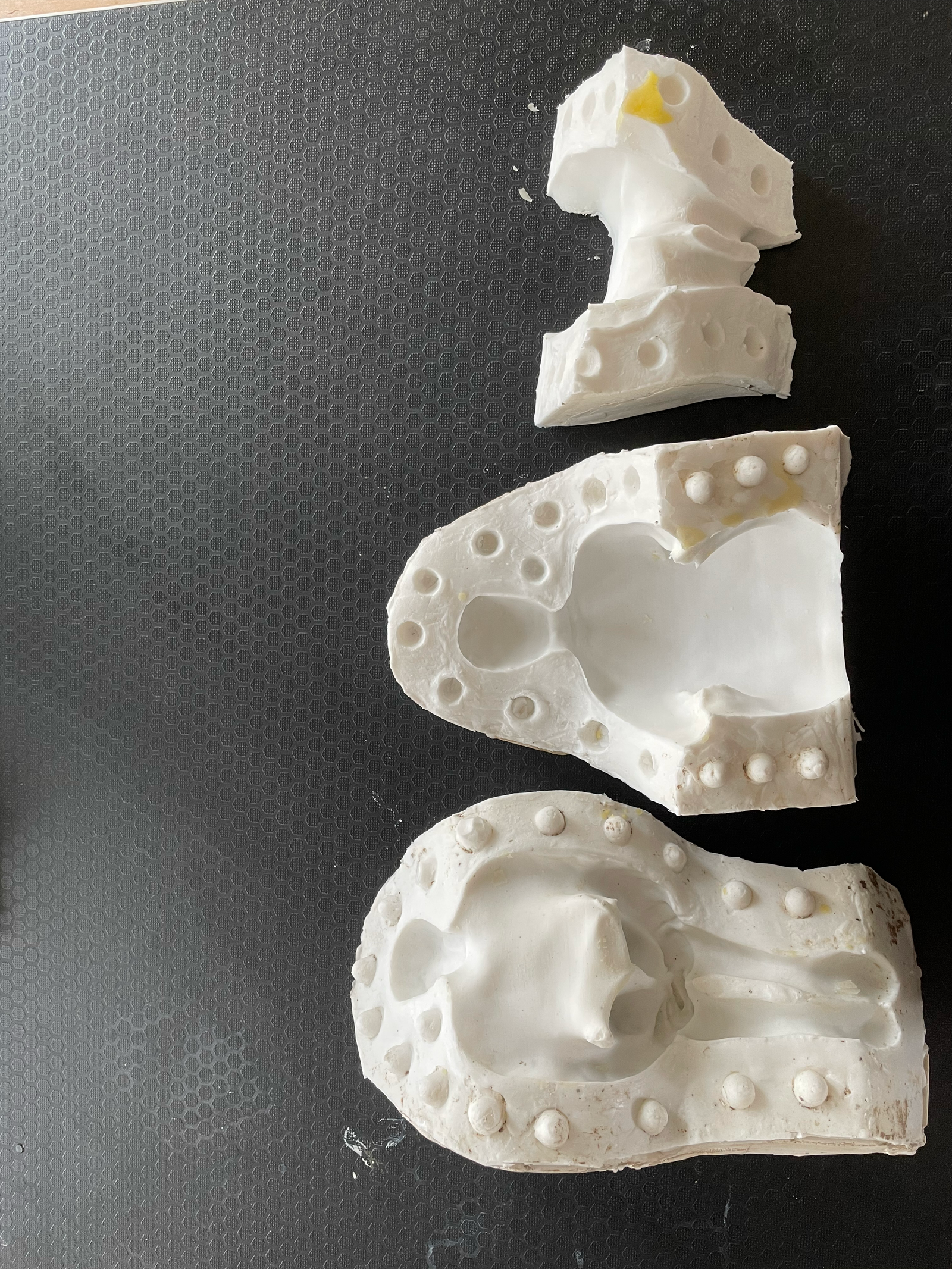 White candle sculpture cast from a figurative plaster original.